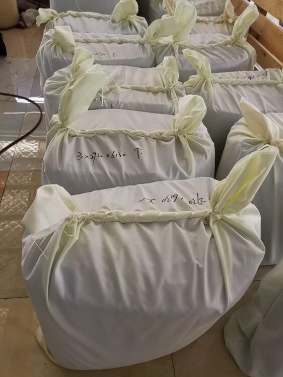 Second packing silicone vacuum bags inside woven bags